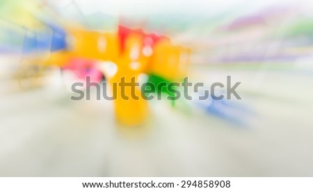 Defocused and blur image of children\'s playground at public park for background usage .