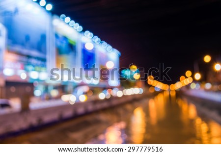 image of blur street and canel  bokeh  in night time with warm colorful lights for background usage .