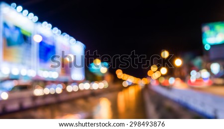 image of blur street and canel  bokeh  in night time with warm colorful lights for background usage .
