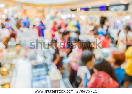 image of blur people at pet show in hall for background usage .