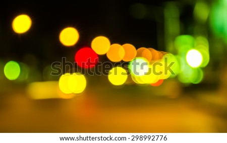 image of blur street  bokeh  with green tone lights in night time for background usage .