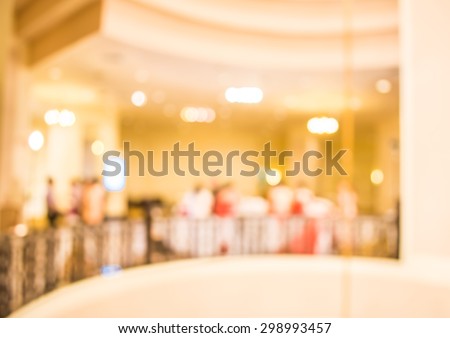 image of blur people at party in hall for background usage .