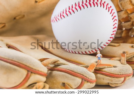 image of mini figure kid dolls with base ball glove and ball
