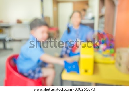 image of blur chlid play toy set on table  for background usage .