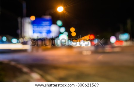 image of blur street  bokeh  with warm colorful lights in night time for background usage .