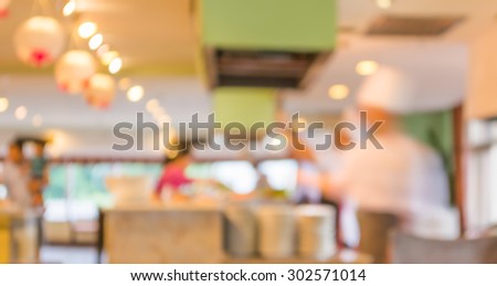 blur image of chef serve food in hetel restaurant for background usage.