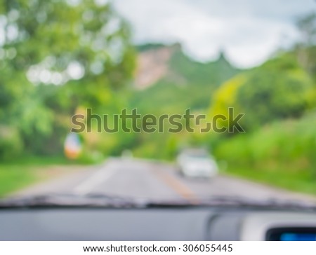 blur image of inside cars to see the road  with bokeh lights for background usage.