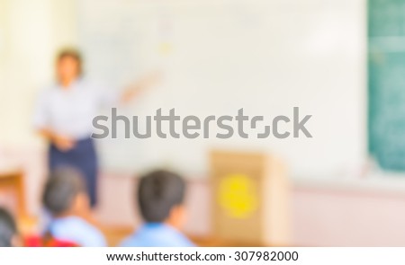 blur kids and teacher in the classroom for background usage.