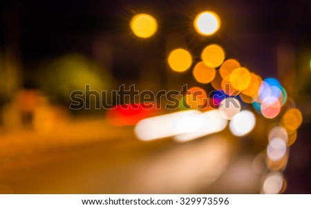 image of blur street bokeh with lights in night time for background usage .