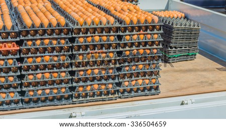 image of egg pallets in the truck on day time.
