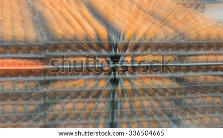 blur image of egg pallets in the truck on day time.