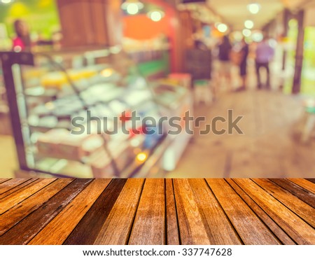 vintage tone image of blur bakery shop with bokeh for background usage.