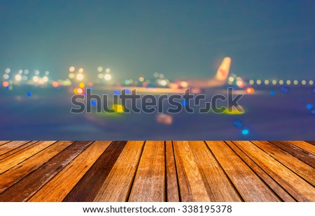 vintage tone blur image of runway in night time with bokeh for background usage.
