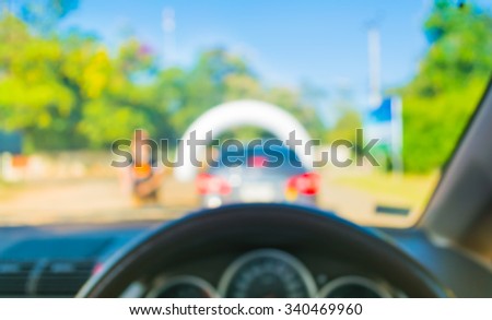 blur image of inside car with bokeh on the rally track  for background usage .