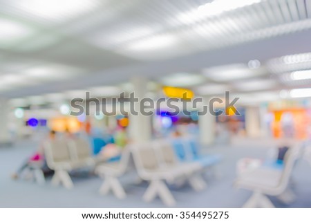 Blurred waiting chairs zone in airport or bus station,use as background.