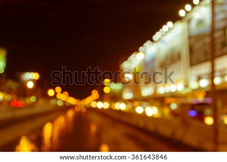 vintage tone image of blur street bokeh with colorful lights in night time for background usage .