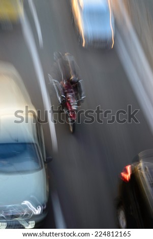Bike rides on the road at high speed Motorcycle riding among cars Speed line Slow shutter speed