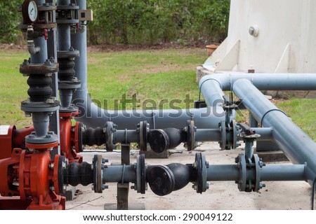 red motor water pump and water pipes