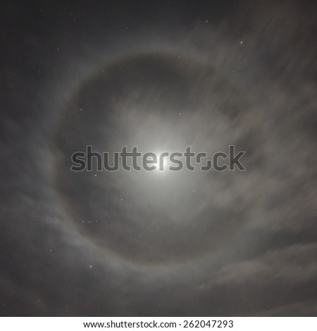 Natural phenomenon in the night sky. Moon halo.