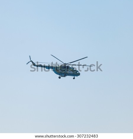 Crimea - 26 July 2015: parade in honor of the Day Russian Navy in Sevastopol. Flight MI-8 helicopter over the bay of the city