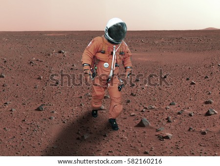 Astronaut walking on planet mars. \