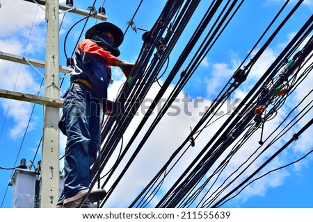 Electrician Wiring Cable on Power line