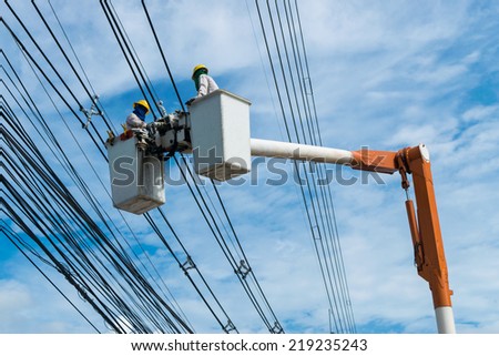 Electrician Wiring Cable on Power line