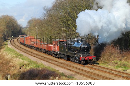 Preserved steam train on a freight service past Kinchley Lane. GCR. UK