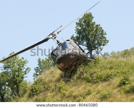 June 2011. Agusta Bell AB.212 helicopter of the Italian Army flying low in the tactical training area near Lamezia in southern Italy.