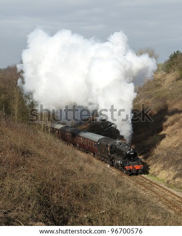 February 2012. Former London Midland and Scottish Railway Class 5MT steam locomotive Climbing hard from Leekbrook Junction towards Cauldon Lowe. Passing through the cutting at Bradnop, Staffordshire.