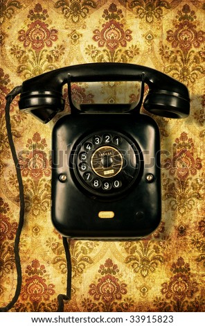 Retro telephone on retro wallpaper