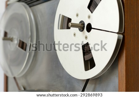 tilt view of an old reel to reel player and tape recorder