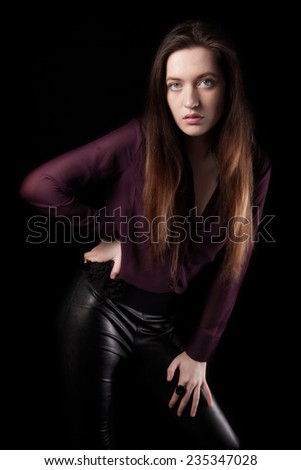 Girl with leather pants, Black background.