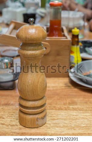 A Wooden Pepper grinder on Local Thailand breakfast table