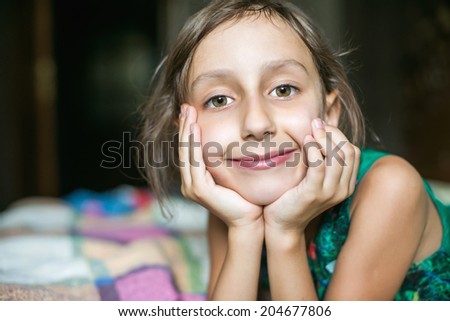 Little girl in happy morning mood waking up - closeup