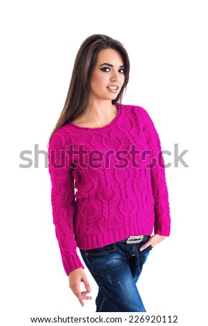 Beautiful woman wearing pink jumper, jeans and razor belt isolated in white