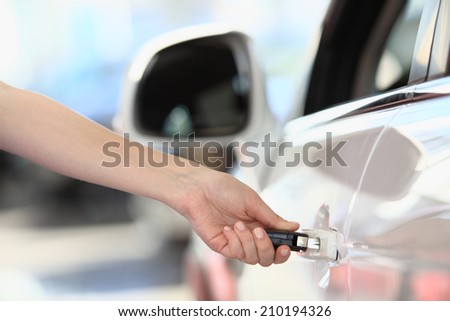 woman\'s hand opens the lock