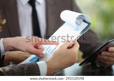 Business people discussing graphics during business meeting