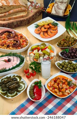 Greek traditional fasting food .Olives,beans,seafoods,traditional salads and bread and a glass of ouzo.