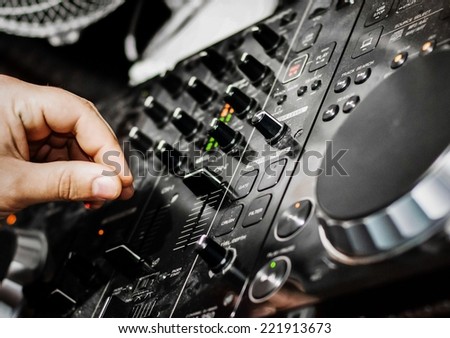 DJ and his hand mixing console