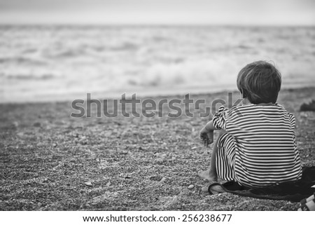 sunset boy on the beach sea summer sorrow filter black and white