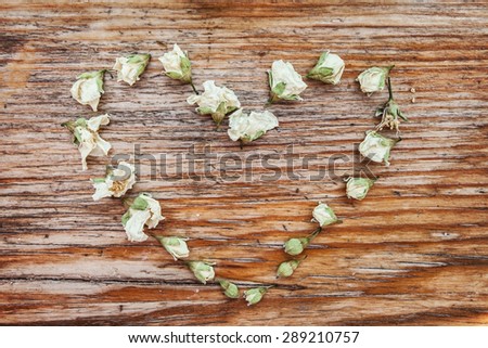heart jasmine dry white flowers wooden base backgrounds