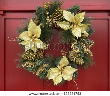 Ornamental Christmas wreath on red door