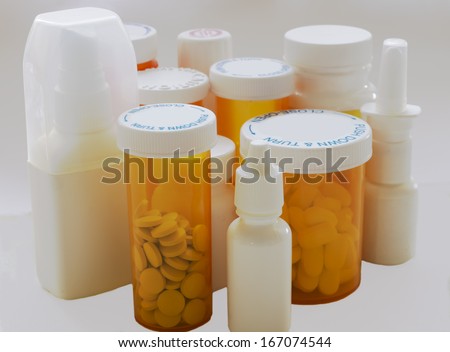 Containers of pills and medicines. All labels have been removed.