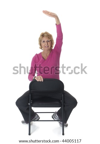 Active senior woman exercising on chair