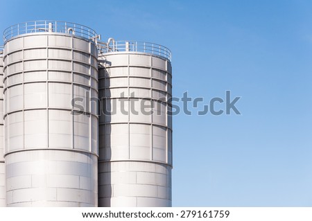 Detail of chemical plant, silos and pipes.