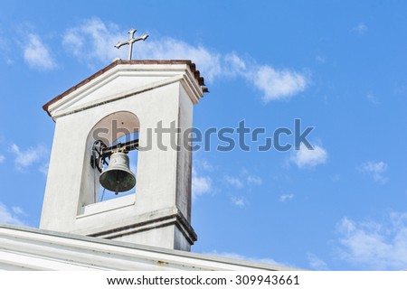 Small bell tower with a bell of a country church i