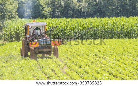 Tractor involved in pesticide treatment of a soybean field