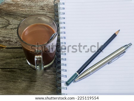 Coffee with notepad and pen