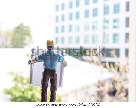 engineer looking work in front of construction site